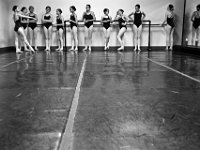 C class students lean up against the barre as they wait to perform Pique turns diagonally across the studio floor at the New Bedford Ballet studio on Purchast Street in the north end of New Bedford.   [ PETER PEREIRA/THE STANDARD-TIMES/SCMG ]